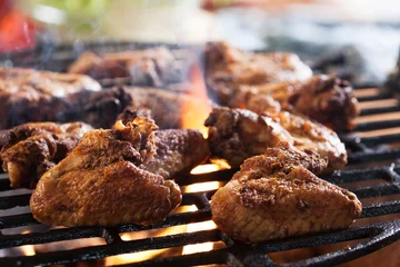 Fotobehang Grill / Barbecue Grilling chicken wings on barbecue grill