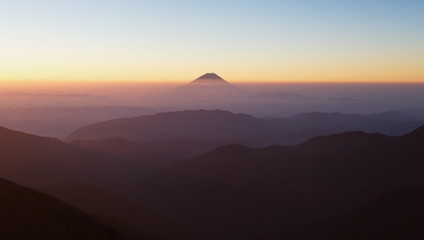 Top of Mountain Fuji with fog and cloud in early summer morning
