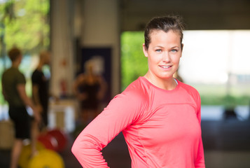 Confident Woman Standing At Healthclub