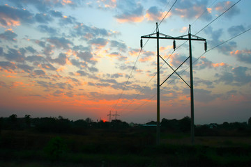 Obraz premium transmission power line on sunset