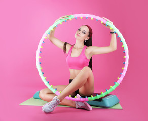 Wellness. Sport Club. Woman Sitting with Sport Equipment