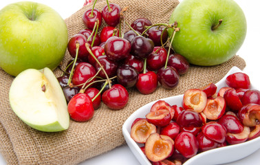 Composition with ripe green apples and cherries