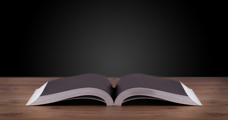 Open book on wooden deck