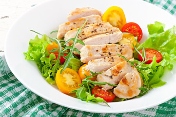 Grilled chicken breasts and fresh salad