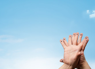 Happy smiley fingers looking at clear blue sky copyspace