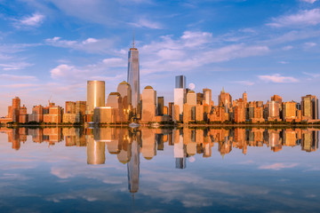 Manhattan at sunset reflected in the hudson river