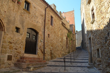 Fototapeta na wymiar Stairs in street in medieval Spanish village