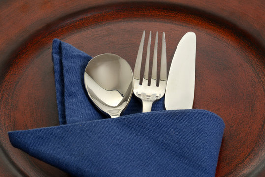 silverware in blue napkin