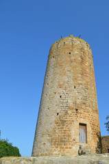 Tall ancient tower in medieval village of Pals