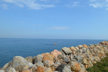 Fototapeta na wymiar Rock wall of a jetty
