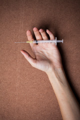 woman hand and drug Syringe