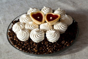 French vanilla meringue cookies and two sweet hearts