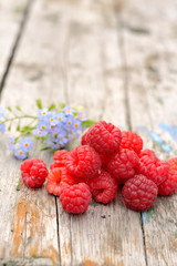 raspberries on wooden background