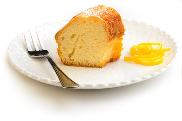 slice of cake garnished with lemon peel