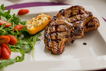 Grilled beef steak on white plate