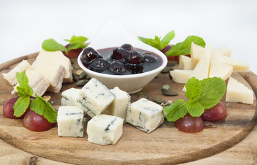 cheese plate with several varieties of cheese in the restaurant