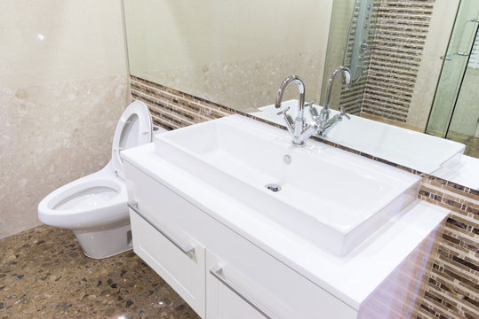 white sink washbasin and silver faucet