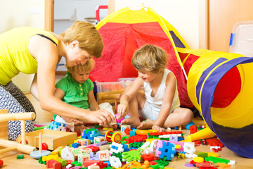Mother and children playing