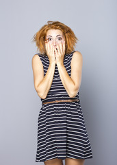 Bright positive girl with short red hair