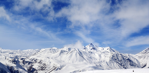 Winter snowy mountains at wind day