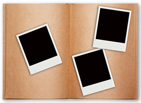 three polaroid frame with old book open