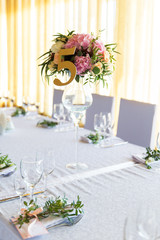 Floral arrangement for decoration wedding table for guests. Room