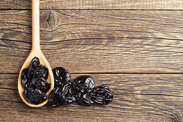 Prunes in spoon and near