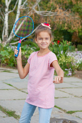 Cute girl with racket Outdoors