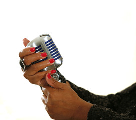African-American singer's hands holding microphone