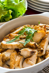 salad with roasted chicken meat on wooden table
