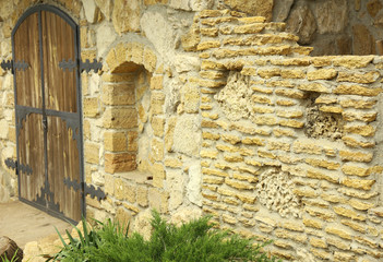 Stone wall with wooden door