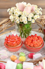 Fototapeta na wymiar Tasty cupcakes on wooden table, close up