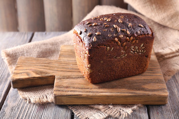 Fresh bread on wooden table, close up