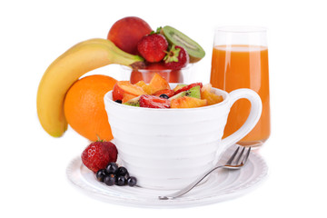 Fresh fruits salad in bowl with berries and juice