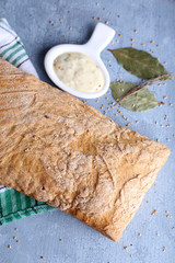 Fresh baked bread on wooden background
