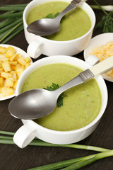 Leek soup on table, close up