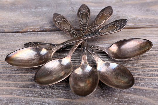 Old Vintage Spoons On Wooden Table