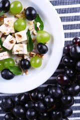tasty salad with grape and cheese, close up