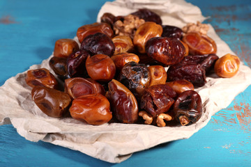 Tasty dates fruits on blue wooden table