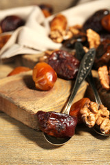 Tasty dates fruits on wooden table