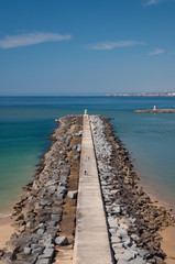 Fototapeta na wymiar Breakwater in Portimao bay, Portugal