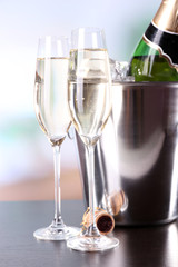 Champagne in glasses and bottle in restaurant
