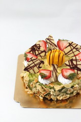 Delicious cheese cake with  fruit toping.