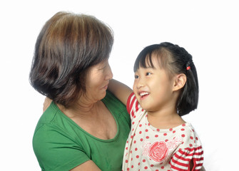 little asian granddaughter smile to her grandmother