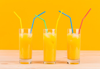 Glasses full of orange juice.