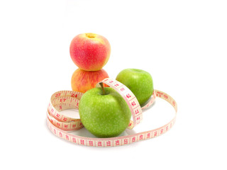 measuring tape wrapped around a green apple for diet