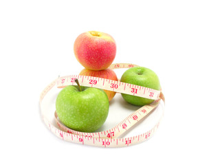 measuring tape wrapped around a green apple for diet