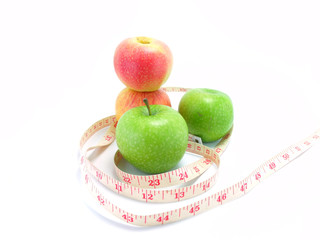 measuring tape wrapped around a green apple for diet