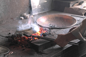 Traditional tinsmith or coppersmith work bench in Turkey
