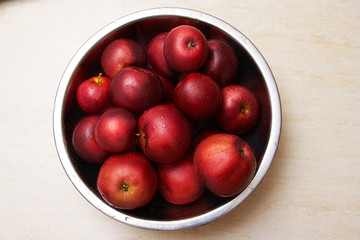 Red juicy apples in a bowl